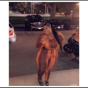 Fashion Nova off the shoulder cut out snakeskin jumpsuit